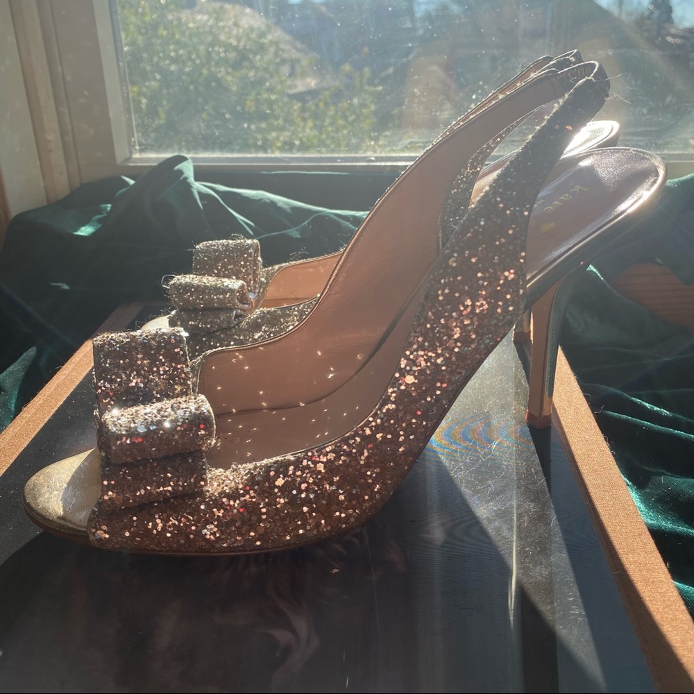 Kate Spade “Charm” Glitter Heels in Pale Bronze